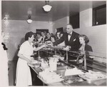 Dr. Hobart M. Corning, Superintendent of D.C. Schools, joins the cafeteria line for a low-cost Type A lunch at McKinley High School, Washington, D.C. by USDA