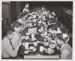 Potatoes are on the menu every day at Tifereth Jerusalem, a Jewish parochial school, on New York City's Lower East Side. The boys eat their hot nutritious noonday meal, with boiled potatoes and other vegetables. by USDA
