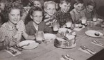 Country children clean up the plates of hot nutritious food served to them under the Federal-State School Lunch Program in which their school - the Liberty Township Consolidates School, near Port Allegany, McKean County, Pa. - participate. by USDA