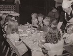 Schoolchildren having a well-planned nutritious lunch sponsored by the home demonstration club and surplus commodities. East Lexington, Va. by USDA