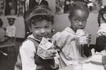 This is one of a series of photographs from Picture Story 217 "New Food Program is First to Feed Pre-School Youngsters", which tells how the U. S. Department of Agriculture is providing food and cash help to needy pre-school children. One of the first pre-school children to be fed under the new USDA Child Nutrition Program is shown here in Gary, Indiana, on November 1, 1968. (Youngsters at day-care centers in Gary, Indiana were the first in the nation to benefit from a new USDA child food service program. Hailed as a "new dimension" in child nutrition, the program provides cash and USDA donated foods to public and private non-profit agencies to help them provide nutritious meals to children in day-care and similar organized activities, and in summer recreation and day camps. Emphasis is on getting food service into activities in low-income areas, and in neighborhoods with high percentages of working mothers.) by USDA