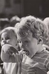 A pre-school child in Milwaukee, Wisconsin is shown June 30, 1969 enjoying a hot meal as part of U.S. Department of Agriculture's expanded school lunch program, which now includes some preschoolers. by USDA