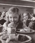 A student at South Edgecomb Elementary School near here is shown eating lunch March 9, 1965. The school participates in the National School Lunch Program, administered nationally by the U.S. Department of Agriculture's Consumer and Marketing Service. by USDA