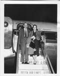 John and Mary Satterfield exiting Delta Air Lines plane. by Author Unknown