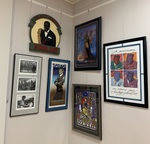 Framed photos and posters with sign by University of Mississippi. Libraries. Archives and Special Collections.