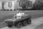 Man and Kids on ATV by Judy Griffin