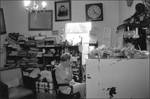 Antique Shop Owner Curling Own Hair by Dianne Jackson