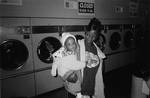 Love: Mother and Child in Laundromat by Robert Caldwell