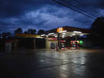 Night-Time Gas Station [North Lamar Boulevard] by Matthieu Dessier