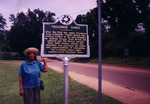 Mrs. Susie Marshall at the Historic sign for Freedmen Town, Oxford, Mississippi by Photographer Unknown and Susie Marshall